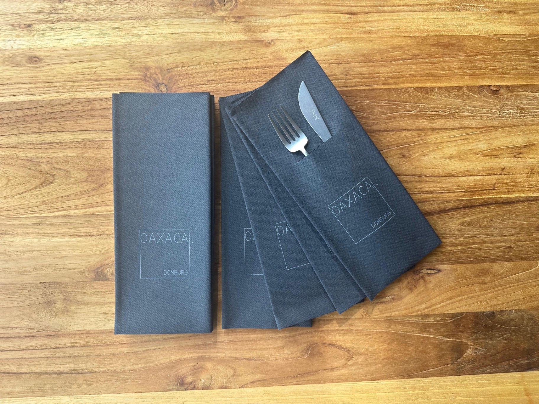 Donkergrijze PocketServet®ten met logo van Oaxaca Domburg